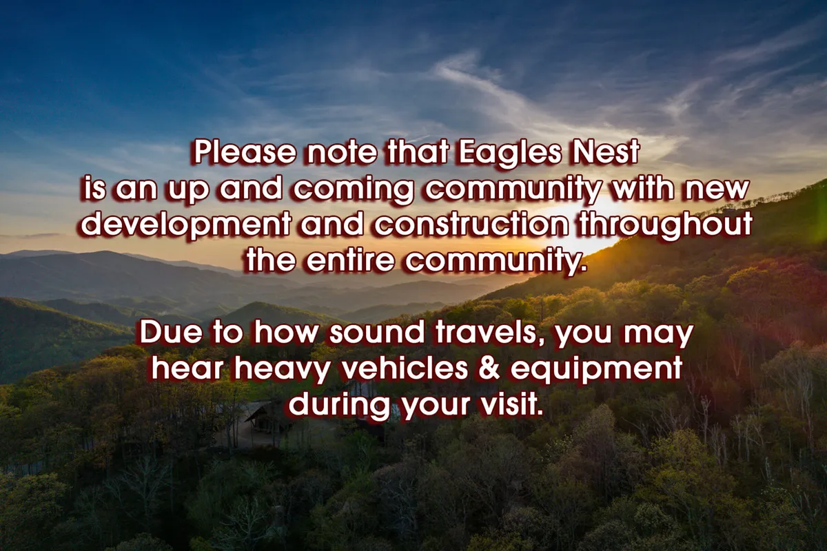 A breathtaking view of the Blue Ridge Mountains at sunset, with lush green hills and a sweeping sky, showcasing the vast natural playground surrounding Eagles Nest. The scene captures the sense of adventure and limitless possibility that defines the area.